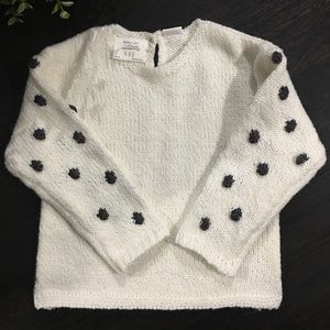 Zara sweater sleeve with pompom